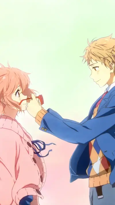 A boy gently adjusts a girl's glasses
