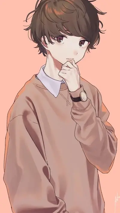 A boy with brown hair wearing a light brown sweater