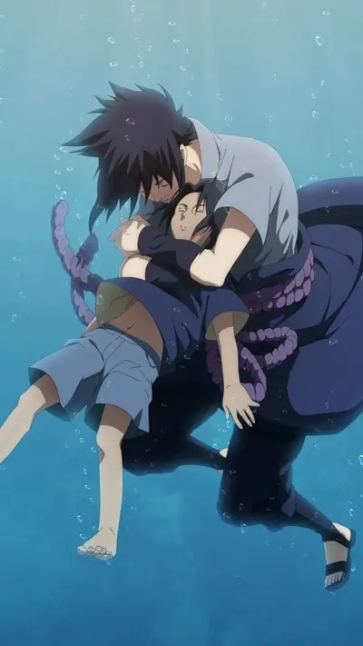 A father figure embraces a young boy underwater