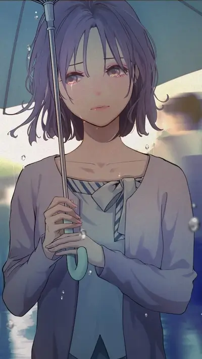A girl cries under an umbrella in the rain