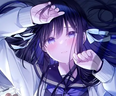 A girl in a sailor uniform cries while lying down