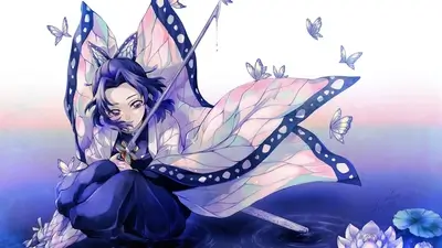 A girl with butterfly wings sits by the water