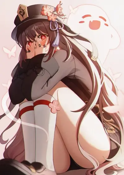 A girl with long hair sits hugging herself