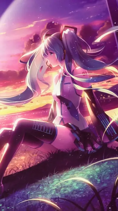 A girl with long teal hair sits on grass at sunset