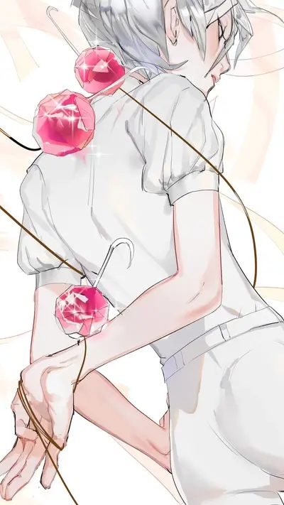 A girl with pink gems tied to her arms