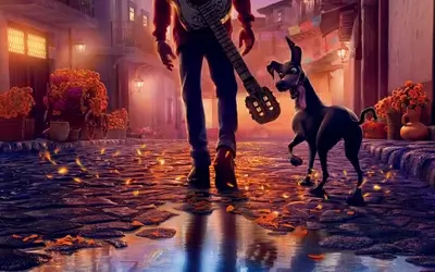 A man and his dog walking down a cobblestone street