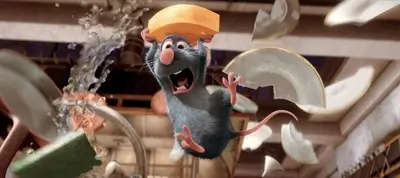 A rat joyfully holds a cheese wedge amidst broken dishes