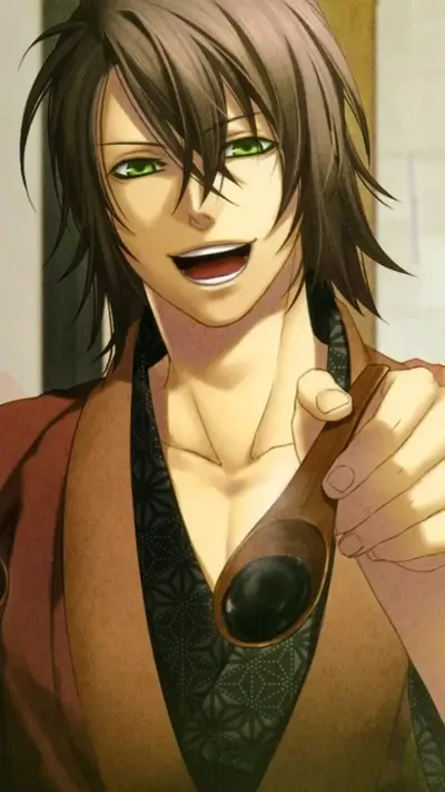 A smiling man with green eyes holds a wooden spoon