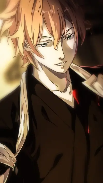 A young man with orange hair, wearing a dark jacket