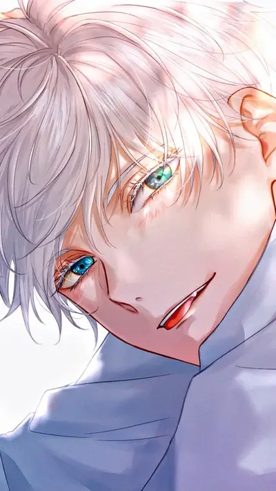 A young man's face, looking down, with striking, different colored eyes