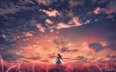 Alone girl in field at colorful sunset, standing in tall grass.