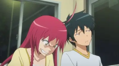 Angry red haired girl gritting teeth beside bored dark haired boy