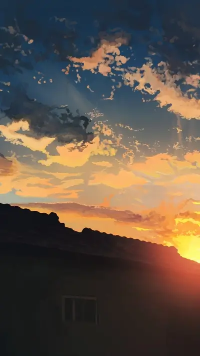 Beautiful sunset with orange-gold colors, clouds, and a roof line of building