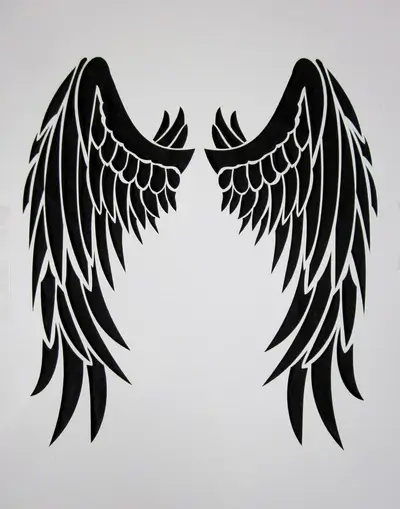 Black wings stencil on white background