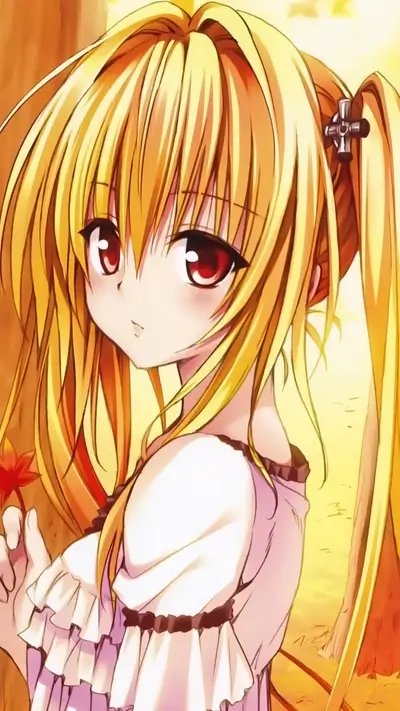 Blond girl in a frilly dress, holding a flower