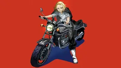Blond-haired young man sitting on a motorcycle