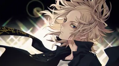 Blonde boy in a dark coat looking over his shoulder