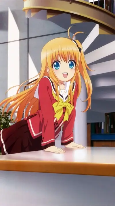 Blonde girl with blue eyes smiling happily in a red school uniform