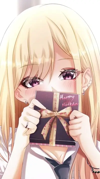 Blushing girl holding a birthday gift