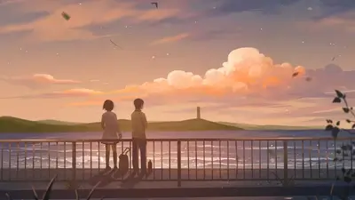 Boy and girl standing by a railing during sunset at sea