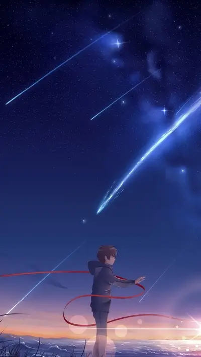 Boy looking at shooting stars against a night sky
