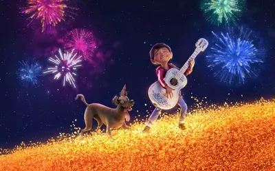 Boy playing guitar with dog, fireworks in the background