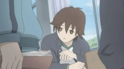 Brown-haired schoolboy looking up at classmates at his desk