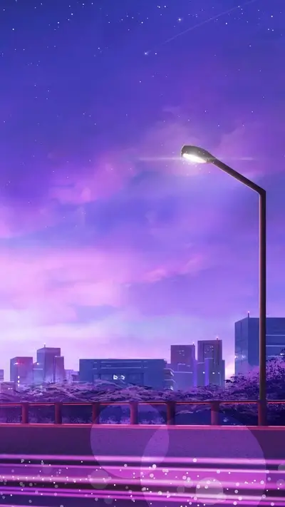 Cityscape at night with a single streetlight