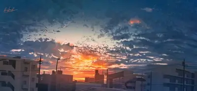 Cityscape at sunset, clouds fill the sky
