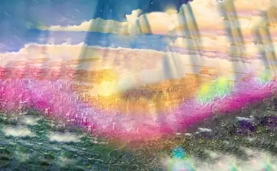 Cityscape viewed from above, radiant light beams illuminating buildings and clouds