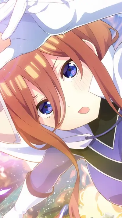 Close-up of a girl with brown hair and big blue eyes