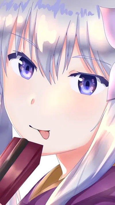 Close-up of a girl's face, licking a sweet treat