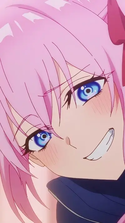 Close-up of a girl's face, pink hair, blue eyes, smiling