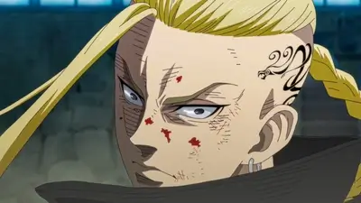 Close up of Draken with a dragon tattoo and blooded face