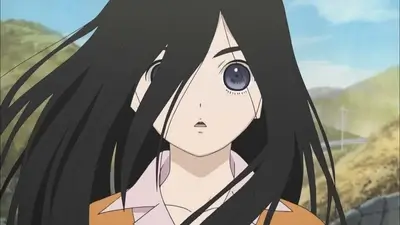 Close-up of long black hair blowing in the wind