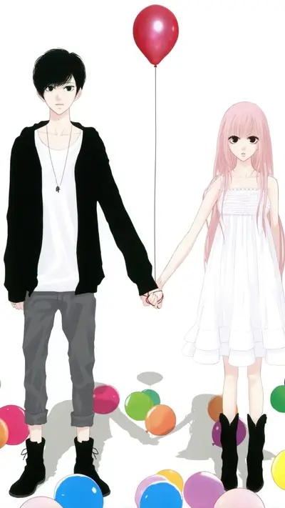Couple holding hands with balloons
