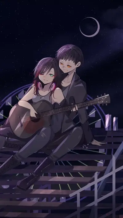Couple playing guitar under the night sky