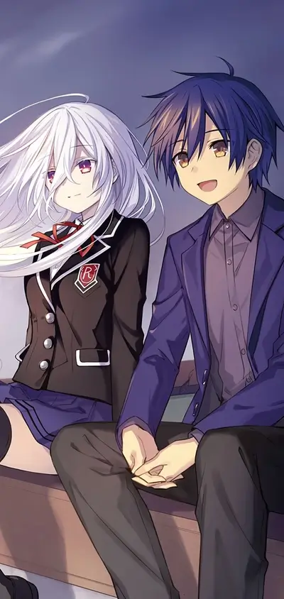 Couple sitting together, holding hands, gazing into the distance