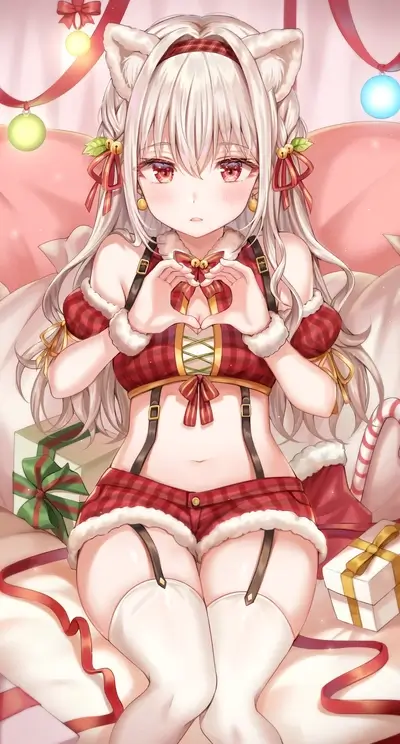 Cute girl in Christmas outfit making heart shape with hands