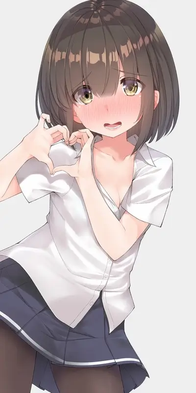 Cute girl making a heart shape with her hands