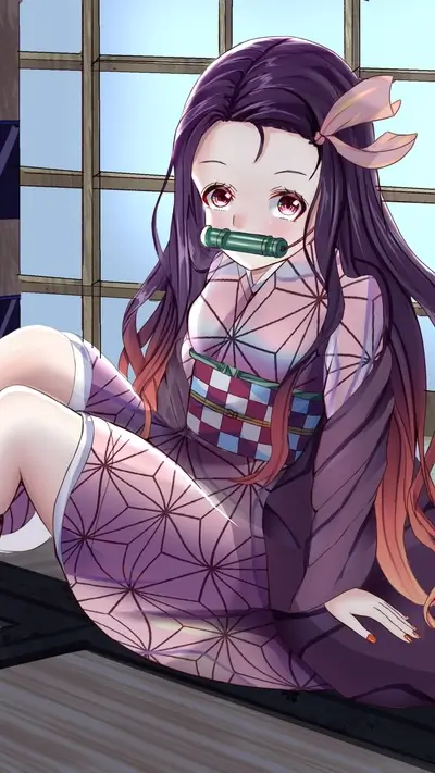 Cute girl with bamboo muzzle sitting in kimono