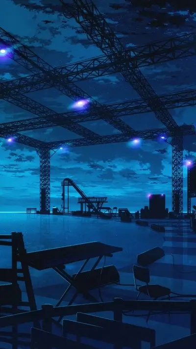 Empty stage at night under a metal structure