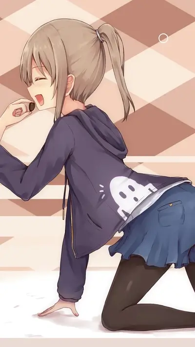 Girl eating a small object, wearing a hoodie