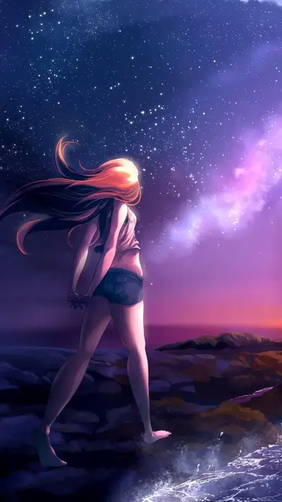 Girl gazing at starry night sky by the ocean