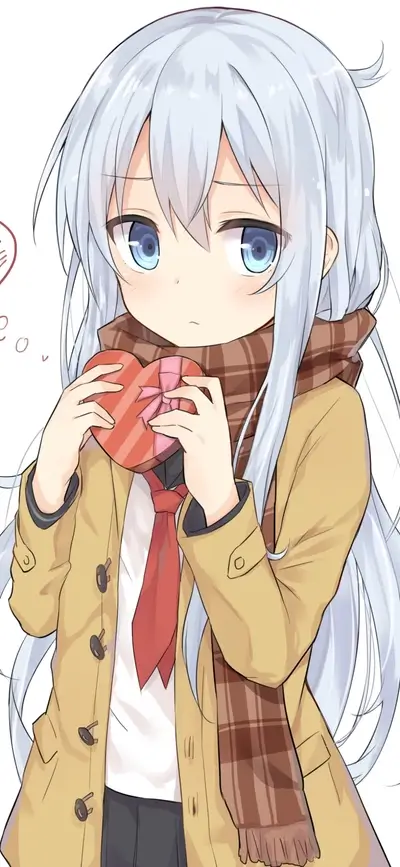 Girl holding heart-shaped chocolate