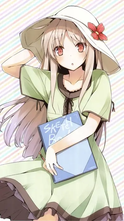 Girl in a sun hat holding a sketchbook
