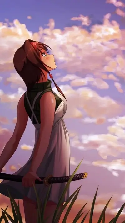 Girl in dress looking up at sunset