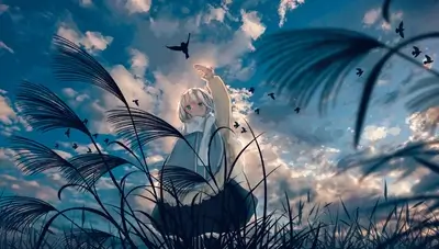 Girl in field reaching for birds