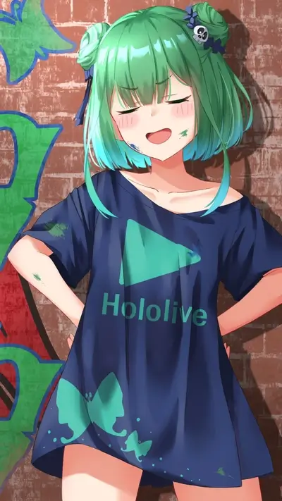 Girl in Hololive shirt standing by a brick wall