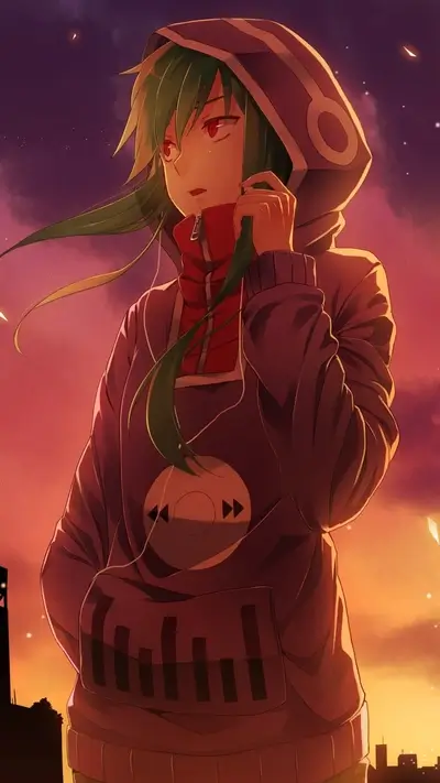 Girl in hoodie listening to music at sunset